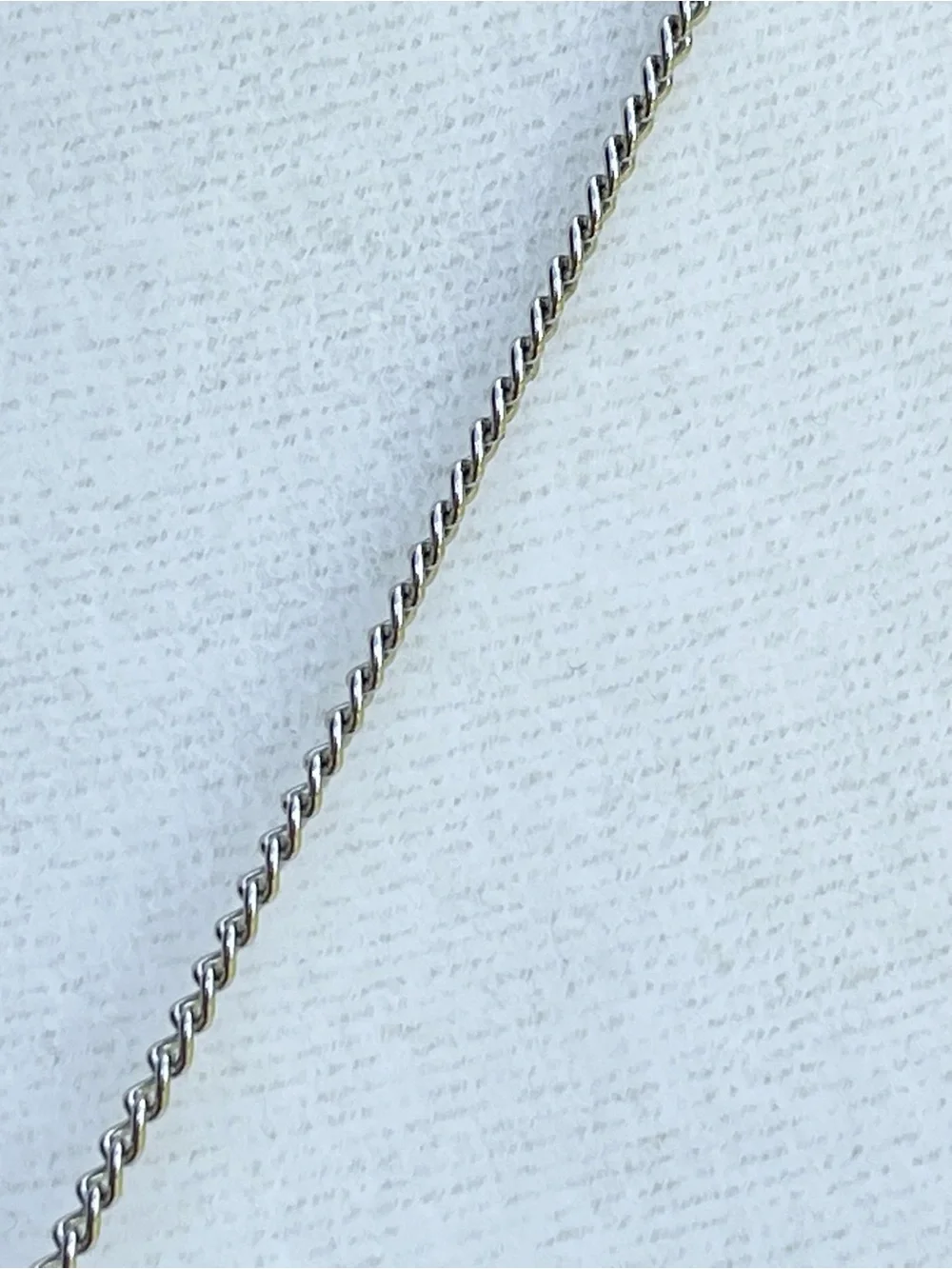 Minnie Mouse shaker charm on silver chain.